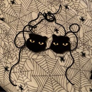 Dolls Kill Black Fuzzy Cat Eye Top with Yellow Eyes